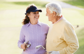 Elderly couple happy playing golf